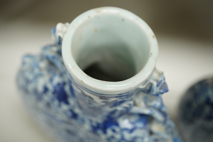 A pair of late 19th century Chinese blue and white moon vases, 23cm. Condition - one vase poor